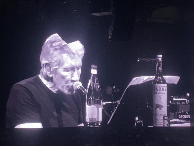 Roger Waters on a screen at the bar